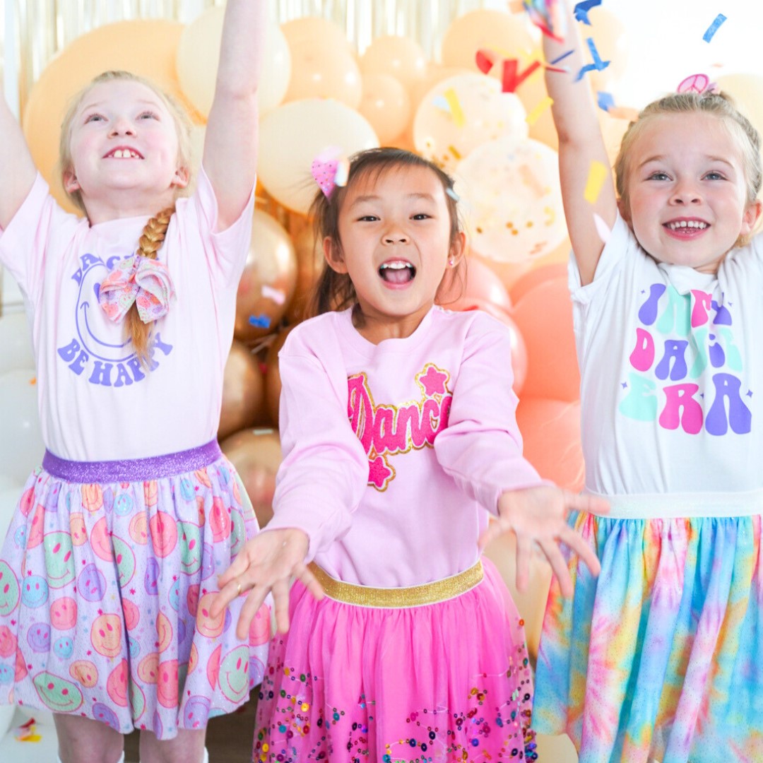 Girls celebrating wearing tutu's and festive shirts