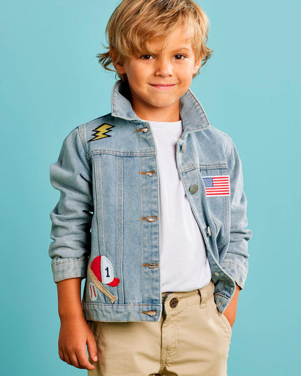 Child wearing a denim jacket with patches