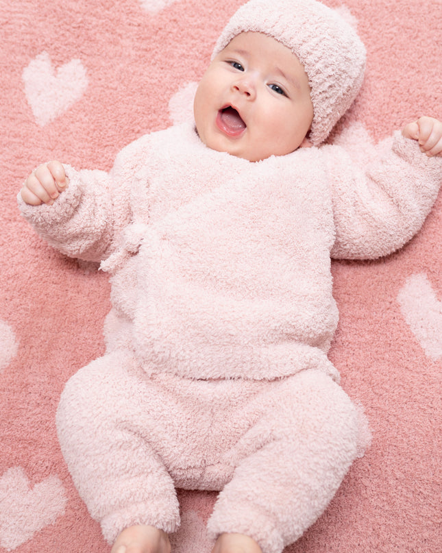 Baby wearing Pink outfit with a kimono wrap top, pants, and hat 