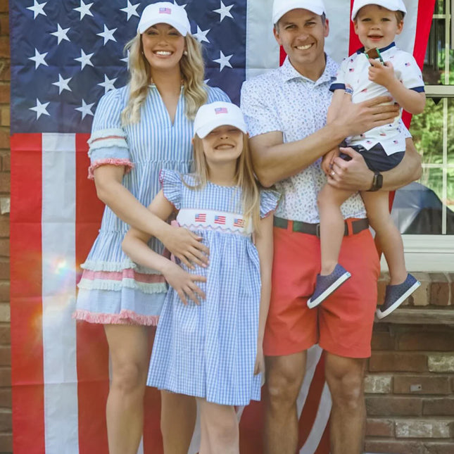 Family wearing matching American flag hats