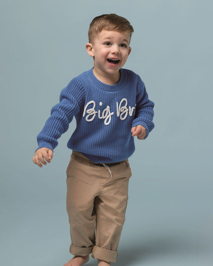 Child wearing blue sweater with Big Bro stitched across the front 