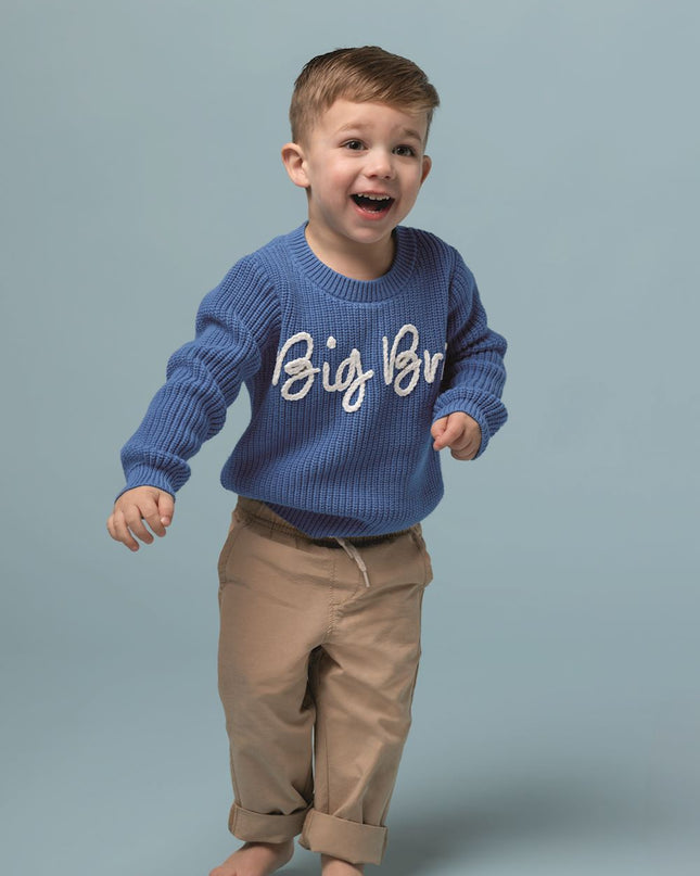 Child wearing blue sweater with Big Bro stitched across the front 