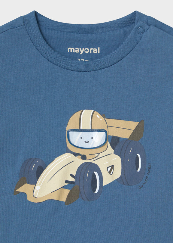 A blue long-sleeve children's t-shirt featuring a cartoon graphic of a race car driver with a helmet that opens and closes
