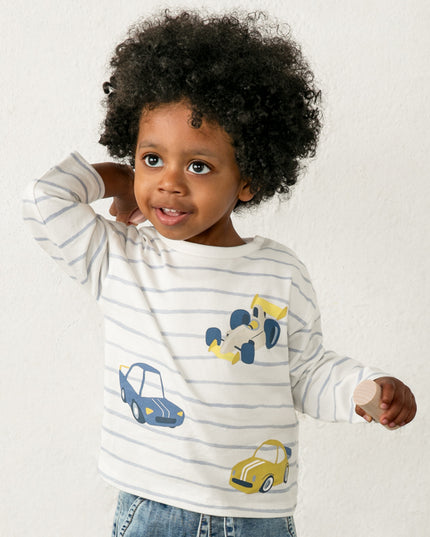Child wearing a striped shirt with car designs 