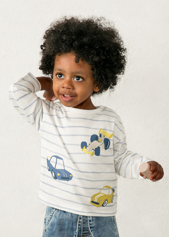 Child wearing a striped shirt with car designs 