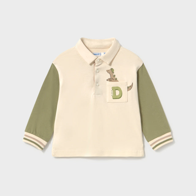 Children's long sleeve polo shirt with green sleeves and a pocket featuring a dinosaur peeking out