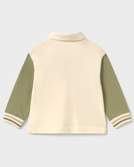 Back of children's long sleeve polo shirt with green sleeves and a pocket featuring a dinosaur peeking out