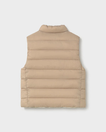 Back of a beige children's puffer vest
