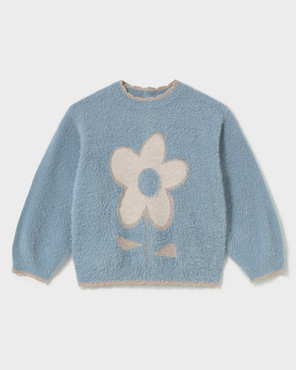 A light blue fuzzy long-sleeve sweater with a large cream-colored flower