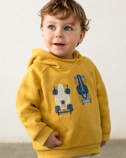 Boy wearing Yellow hooded sweatshirt with white and blue race cars