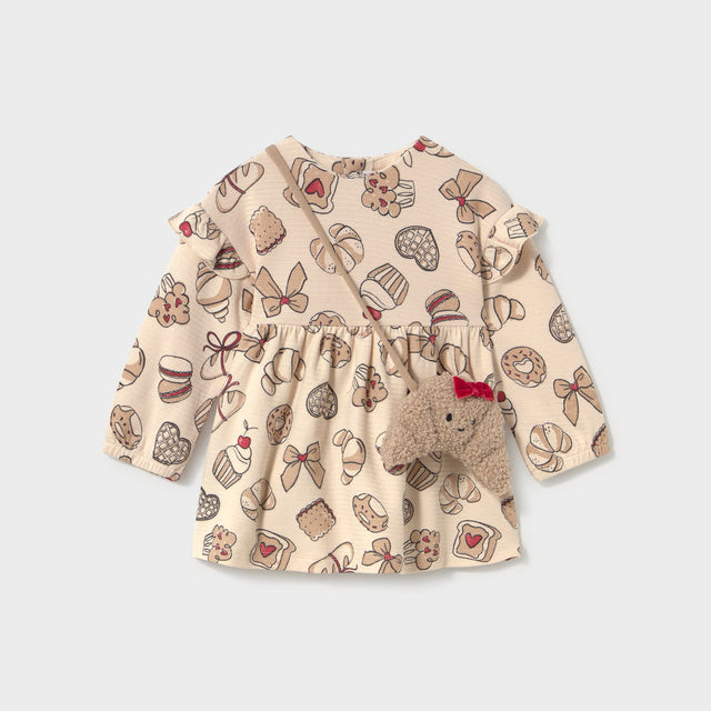 Cream colored dress with pastry print and croissant purse