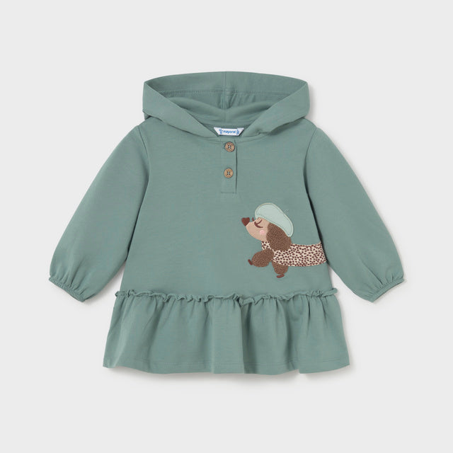 Green hooded dress with a brown and white spotted dog appliqué 