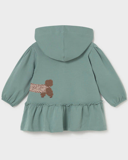 Green hooded dress with a brown and white spotted dog appliqué 