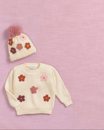 Sweater and Knitted hat with pink pom-pom and colorful flowers