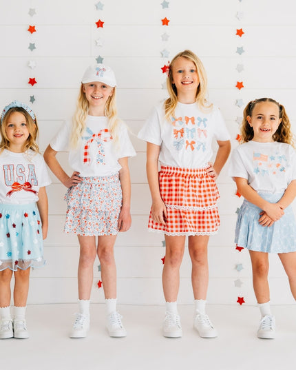 Kids wearing fun red, white and blue outfits