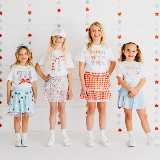 Kids wearing fun red, white and blue outfits