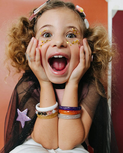 Girl dressed up for halloween wearing bracelets