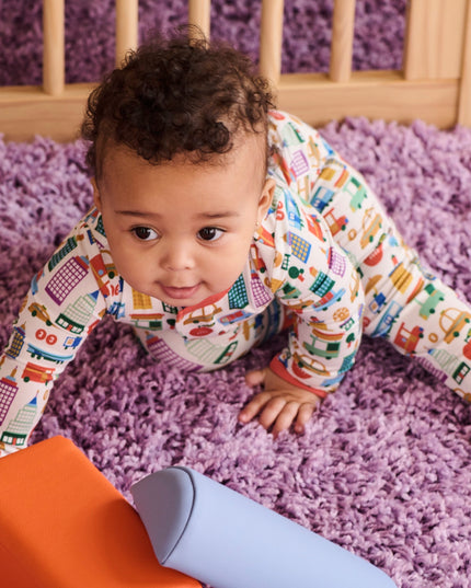 Baby wearing NYC print pajamas