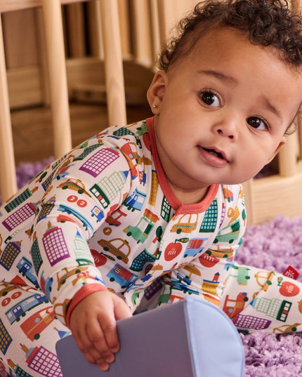 Baby wearing NYC print pajamas