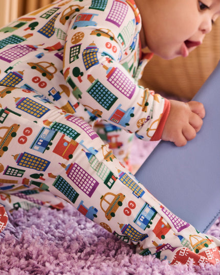 Baby wearing NYC print pajamas