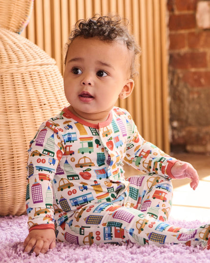 Baby wearing NYC print pajamas