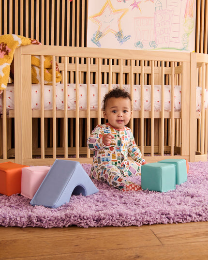 Baby wearing NYC print pajamas