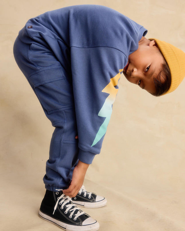 Boy wearing Blue cargo pocket jogger pants and sweatshirt 