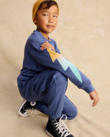 Boy wearing Blue cargo pocket jogger pants and sweatshirt