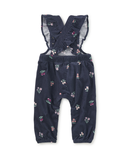 Deep midnight corduroy overalls with floral pattern and ruffle straps