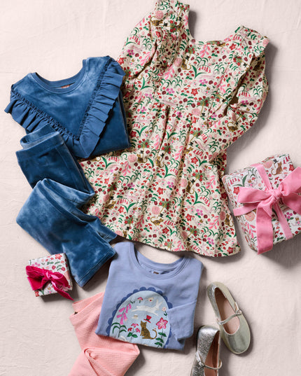 A styled flat-lay of children's clothing and accessories 