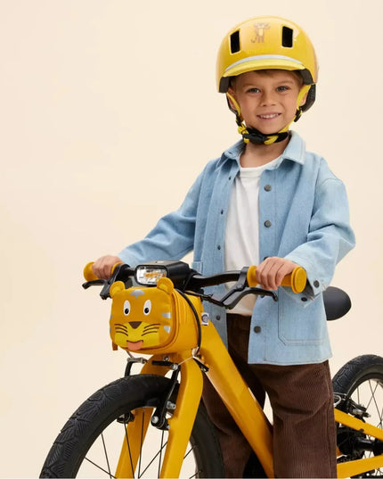 Boy on a yellow bicycle with Tiger shaped bicycle pouch