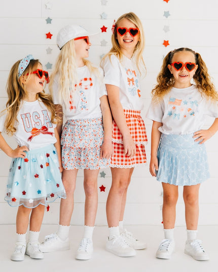 Kids wearing fun red, white and blue outfits