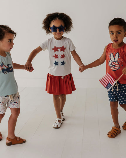 Three children wearing 4th of July outfits