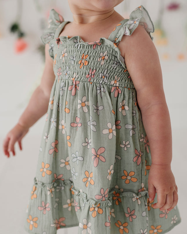Child wearing green floral dress