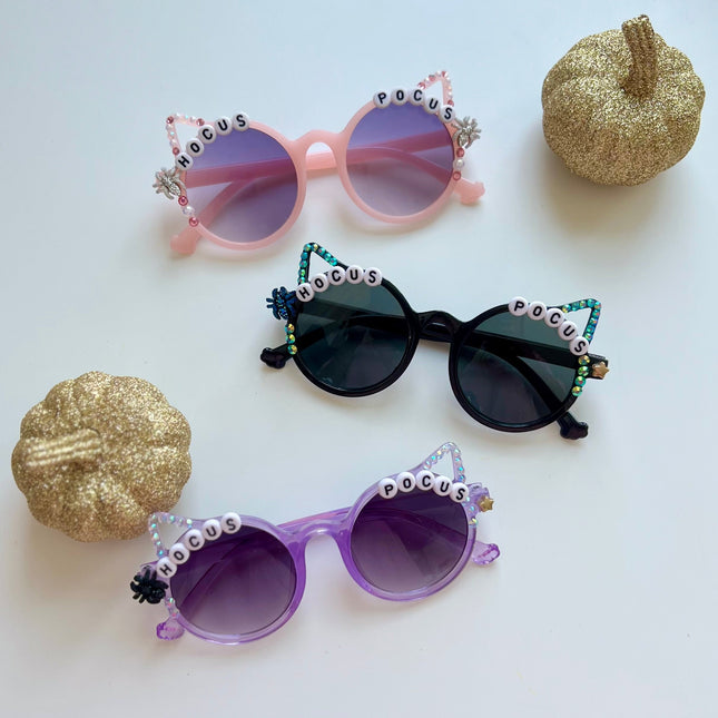Pink, Black and Purple Halloween Cat Ears Sunglasses that say Hocus Pocus