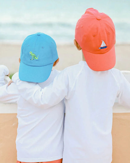 Two boys wearing baseball hats 