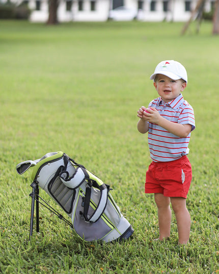 Little boy wearing. Golf Flag White Baseball Hat
