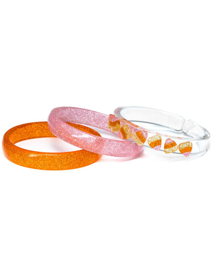 Three bracelets - 1 orange glitter, 1 pink glitter, 1 clear with glittery candy corn pieces