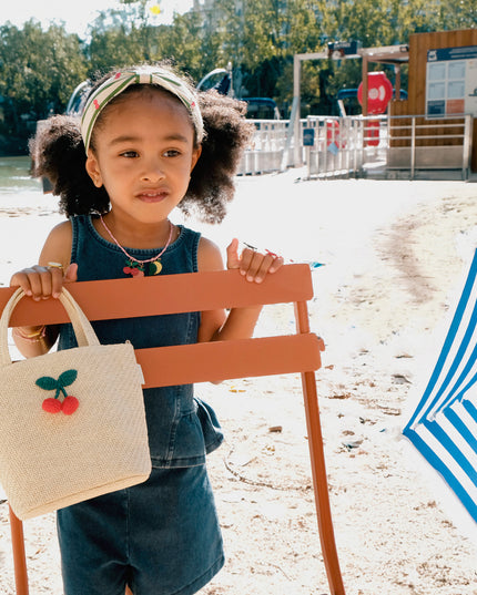 Girl Holding Raffia Basket Bag with Crochet Cherries