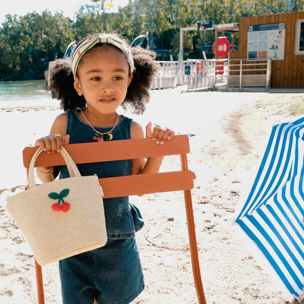 Girl Holding Raffia Basket Bag with Crochet Cherries