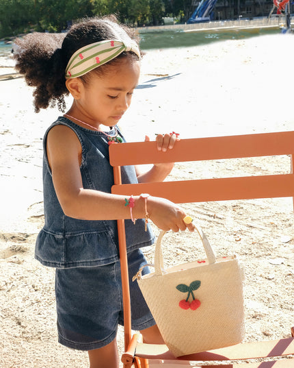 Girl Holding Raffia Basket Bag with Crochet Cherries