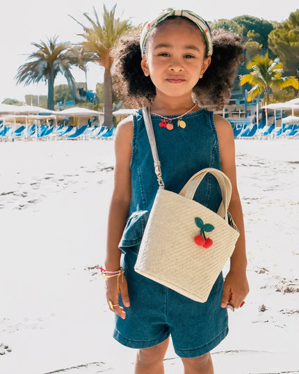 Girl Wearing Raffia Basket Bag with Crochet Cherries Crossbody