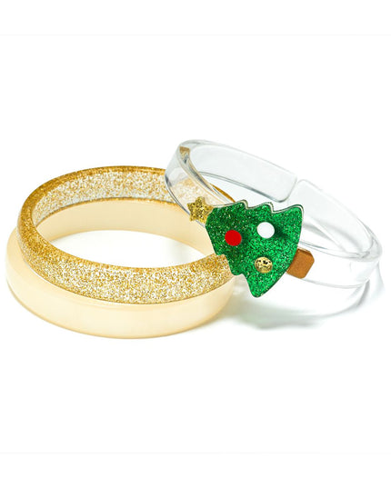 Kids Christmas bracelets featuring a gold glitter bangle, a yellow bangle, and a clear bangle topped with a Christmas tree.
