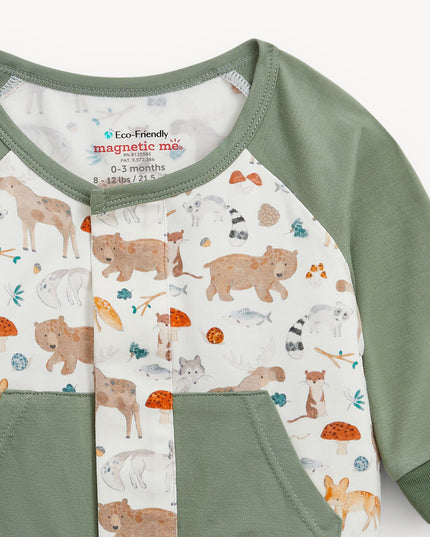 Baby romper with green raglan sleeves, pockets, and cuffs, featuring an all-over woodland animal print.