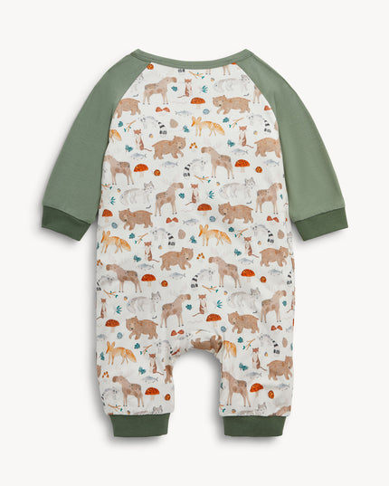 Baby romper with green raglan sleeves, pockets, and cuffs, featuring an all-over woodland animal print.