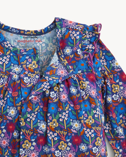 A baby girl's long-sleeve floral jumpsuit in a vibrant blue, purple, and pink mix, featuring ruffled shoulder details and gathered leg cuffs