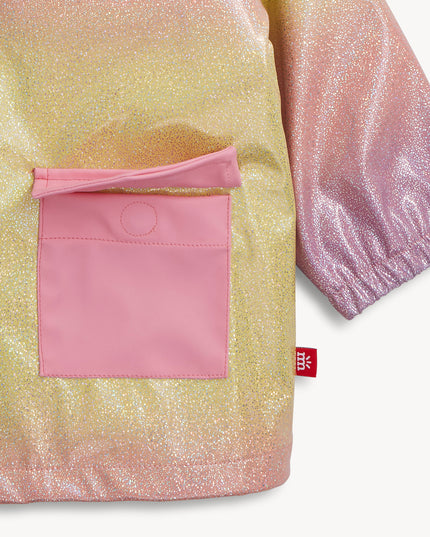 Close up of rainbow unicorn sparkle raincoat pocket with magnetic closures