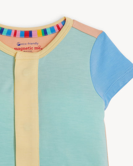 Closeup of blue, green and yellow magnetic romper