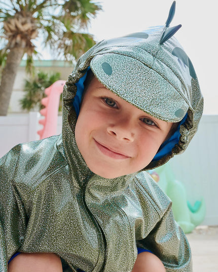 Closeup of boy wearing dino sparkle magnetic raincoat