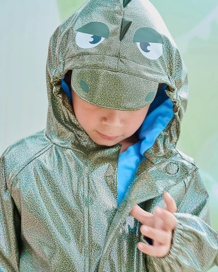Closeup on boy wearing dino sparkle magnetic raincoat